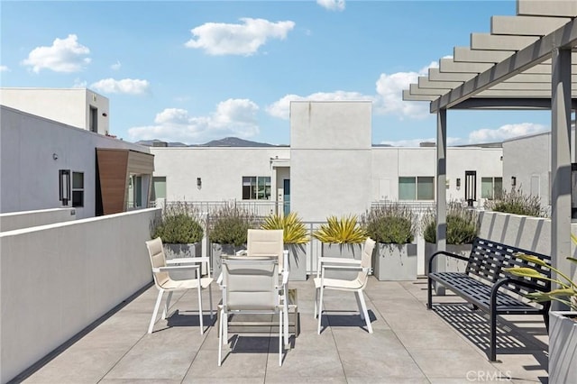 balcony with a patio and a mountain view