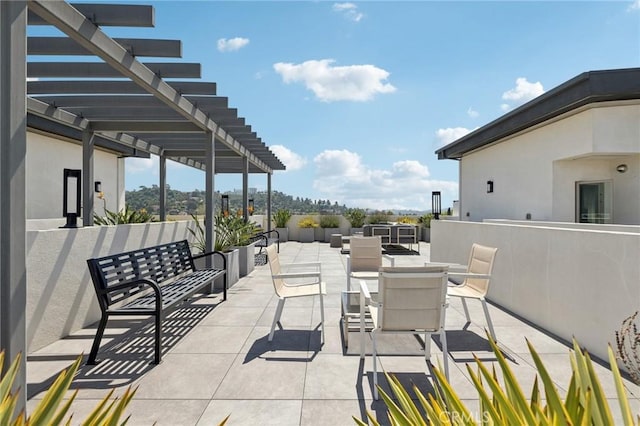 view of patio / terrace featuring outdoor dining area and a pergola