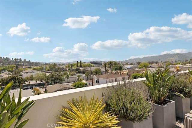 balcony with a mountain view and a residential view