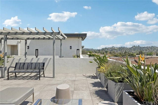 view of patio featuring a pergola