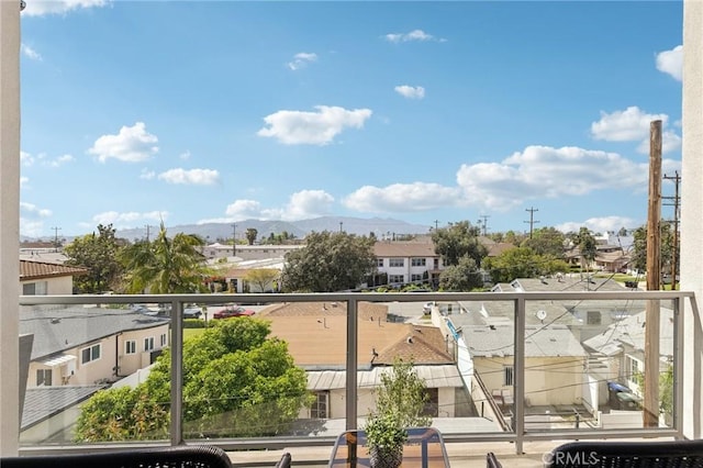 balcony with a mountain view and a residential view