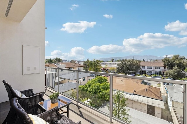 balcony featuring a mountain view