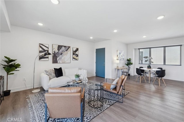 living room with recessed lighting, wood finished floors, and baseboards
