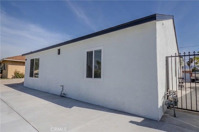view of property exterior with a patio area and stucco siding