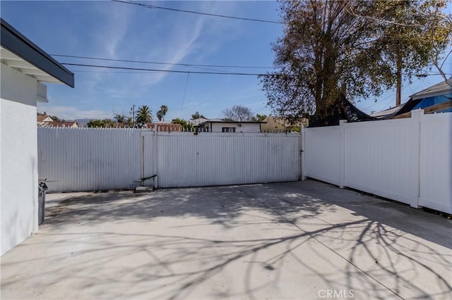 view of patio with fence private yard and a gate