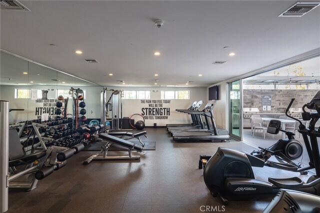 exercise room with recessed lighting and visible vents