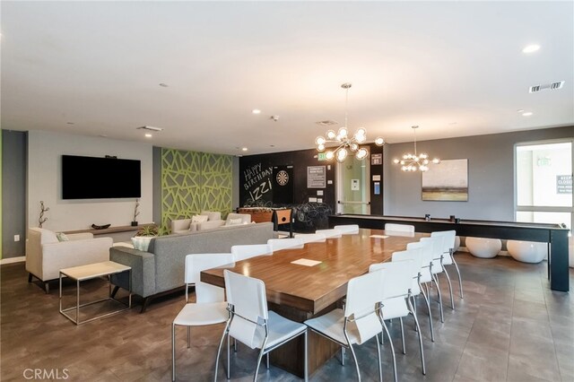 dining space featuring a notable chandelier, recessed lighting, and visible vents
