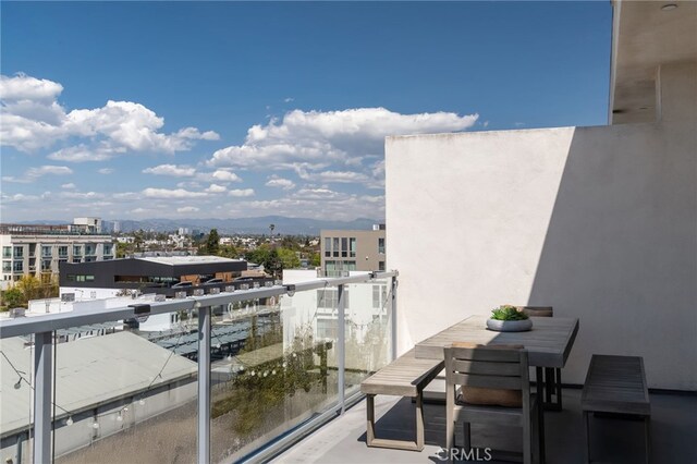 balcony featuring a mountain view