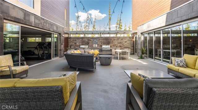 view of patio featuring outdoor dining space, an outdoor living space, and grilling area