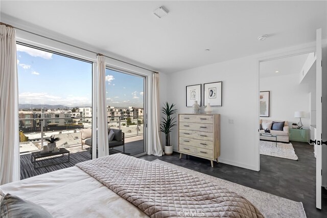bedroom featuring baseboards and access to exterior