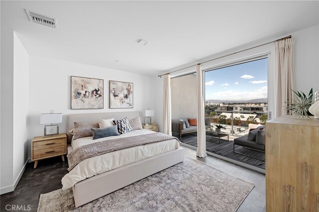 bedroom featuring access to outside and visible vents