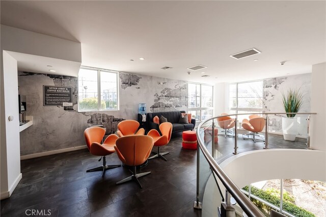 interior space featuring recessed lighting, baseboards, and visible vents