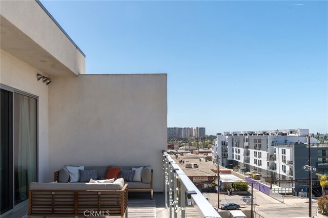balcony with a view of city and outdoor lounge area