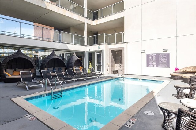 community pool featuring a patio area