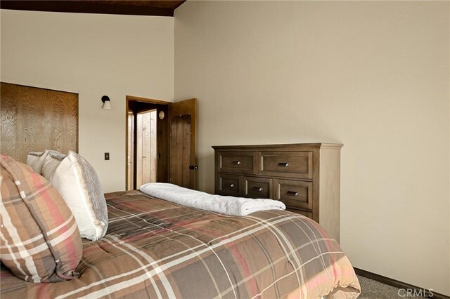 27994 W Shore Rd, Lake Arrowhead, CA 92352 - bedroom with carpet flooring, baseboards, and a high ceiling