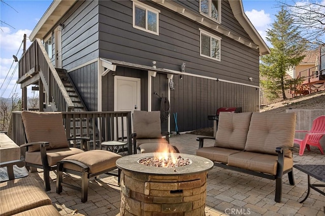 27994 W Shore Rd, Lake Arrowhead, CA 92352 - view of patio featuring an outdoor fire pit and stairway