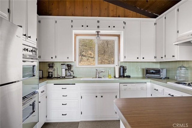 27994 W Shore Rd, Lake Arrowhead, CA 92352 - kitchen featuring white appliances, wood ceiling, vaulted ceiling, white cabinets, and decorative backsplash