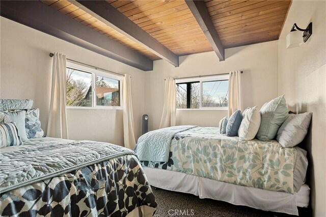 27994 W Shore Rd, Lake Arrowhead, CA 92352 - carpeted bedroom with wooden ceiling with exposed beams
