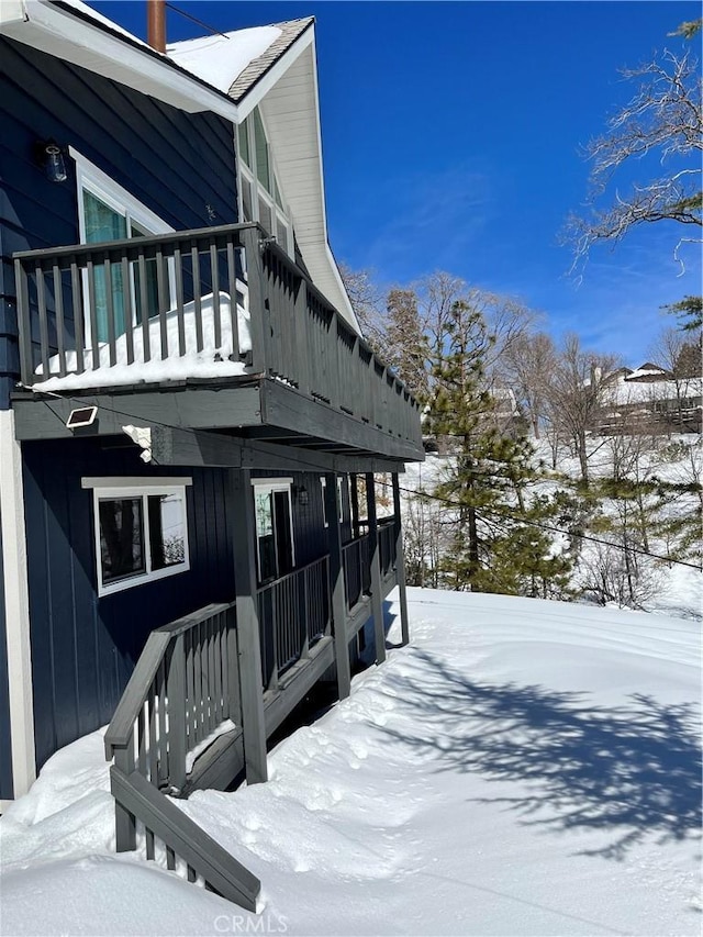 27994 W Shore Rd, Lake Arrowhead, CA 92352 - view of snowy exterior with a balcony