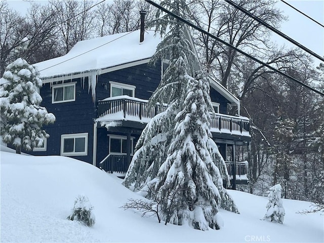 27994 W Shore Rd, Lake Arrowhead, CA 92352 - snow covered property with a balcony