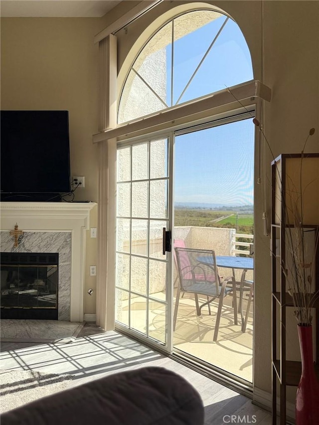 entryway with a high end fireplace