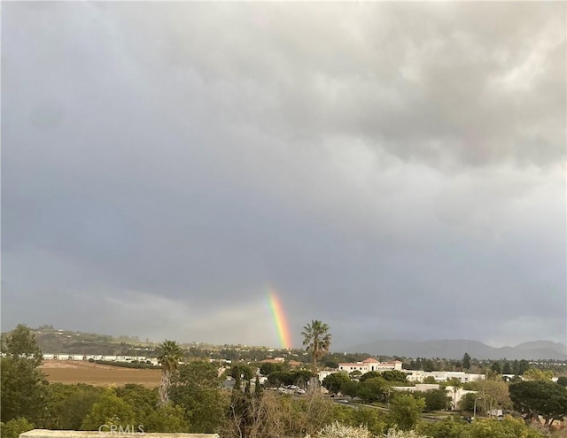 surrounding community with a mountain view