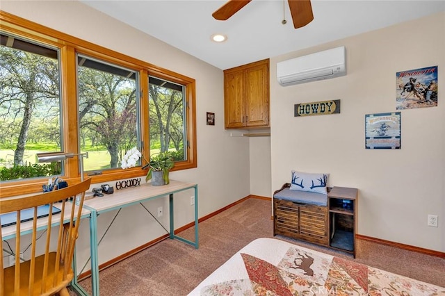 interior space featuring carpet floors, baseboards, ceiling fan, and a wall mounted AC