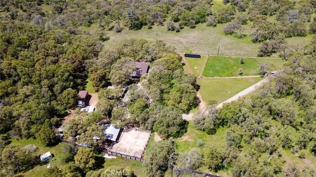 birds eye view of property featuring a rural view and a forest view