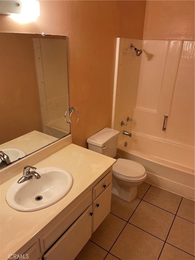 26873 Mossway St, Highland, CA 92346 - full bathroom featuring washtub / shower combination, vanity, a textured wall, tile patterned floors, and toilet