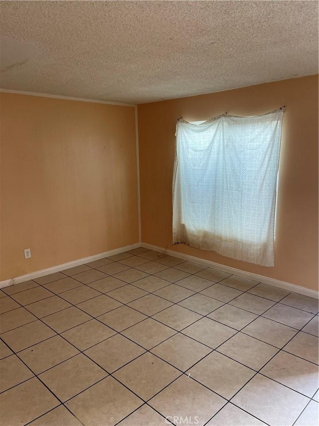 26873 Mossway St, Highland, CA 92346 - unfurnished room featuring baseboards and a textured ceiling