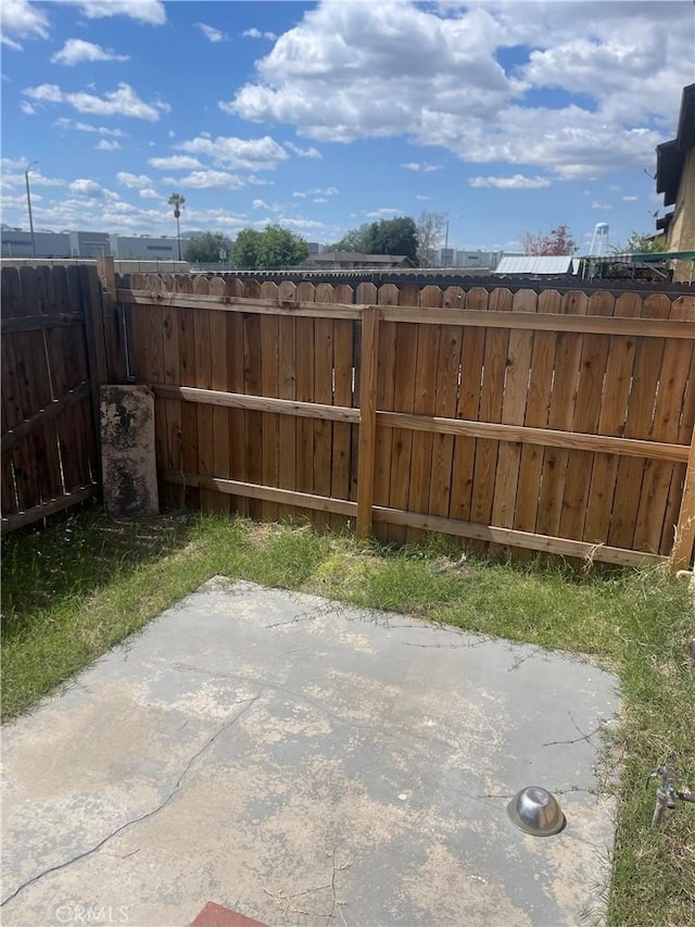 26873 Mossway St, Highland, CA 92346 - view of patio / terrace featuring fence