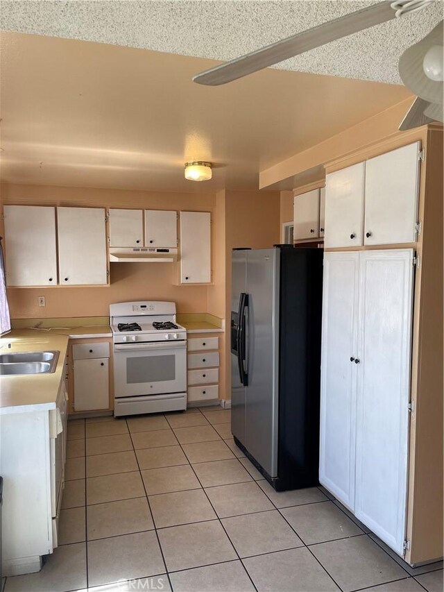 26873 Mossway St, Highland, CA 92346 - kitchen with fridge with ice dispenser, a sink, light countertops, gas range gas stove, and under cabinet range hood