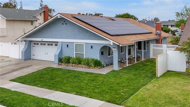 805 W Brentwood Ave, Orange, CA 92865 - view of front of property with stucco siding, solar panels, a garage, and concrete driveway