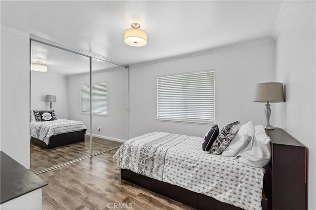 805 W Brentwood Ave, Orange, CA 92865 - bedroom with crown molding, a closet, and wood finished floors