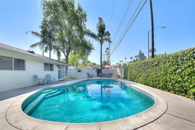 6087 Academy Ave, Riverside, CA 92506 - view of pool with a fenced in pool, a patio area, and a fenced backyard