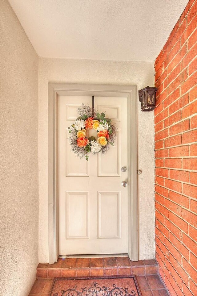 6087 Academy Ave, Riverside, CA 92506 - doorway to property featuring stucco siding