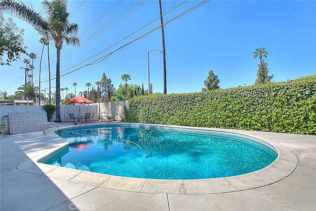 6087 Academy Ave, Riverside, CA 92506 - view of pool with a fenced in pool, a patio, and a fenced backyard
