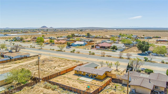 bird's eye view with a mountain view, a residential view, and view of desert