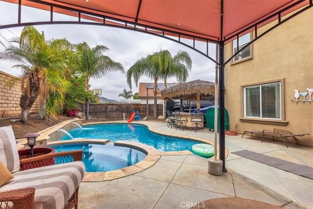 29567 Cool Meadow Dr, Menifee, CA 92584 - view of pool with a gazebo, a fenced backyard, a pool with connected hot tub, and a patio area