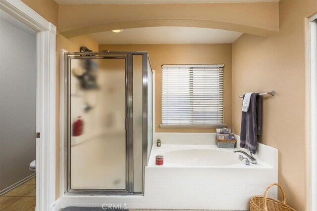 29567 Cool Meadow Dr, Menifee, CA 92584 - full bathroom featuring a bath, a stall shower, and tile patterned floors
