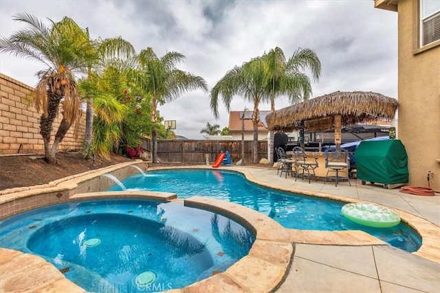 29567 Cool Meadow Dr, Menifee, CA 92584 - view of swimming pool featuring a fenced backyard, area for grilling, a patio, a pool with connected hot tub, and a gazebo