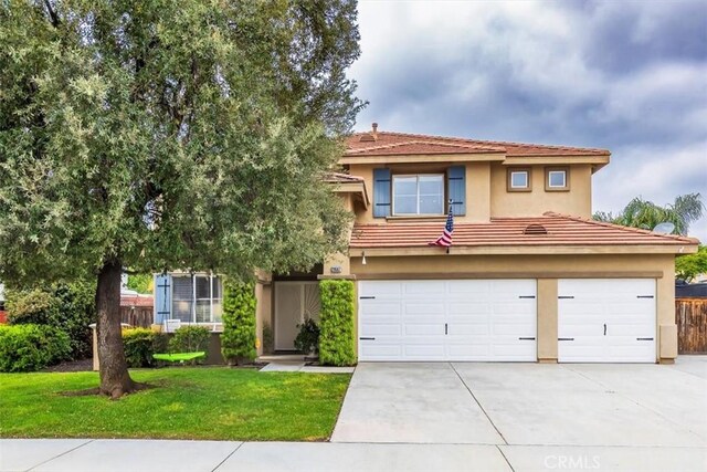 29567 Cool Meadow Dr, Menifee, CA 92584 - view of front of home with a garage, concrete driveway, a front yard, and stucco siding