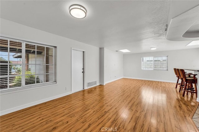 12195 Monte Vista Ave, Chino, CA 91710 - interior space featuring visible vents, baseboards, and light wood-style floors