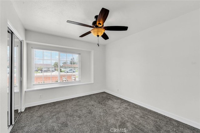 12195 Monte Vista Ave, Chino, CA 91710 - unfurnished room featuring dark colored carpet, baseboards, and ceiling fan