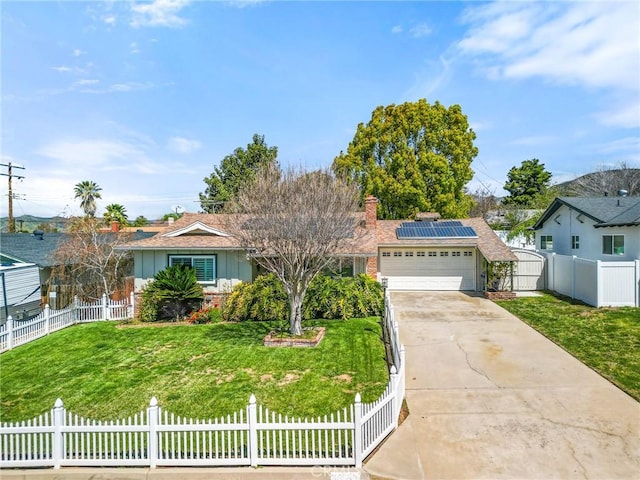 single story home with a front yard, fence private yard, an attached garage, and roof mounted solar panels