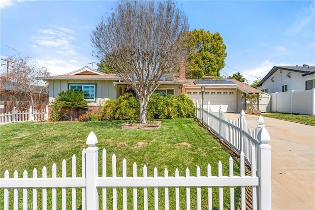 single story home featuring concrete driveway, a front lawn, an attached garage, and a fenced front yard