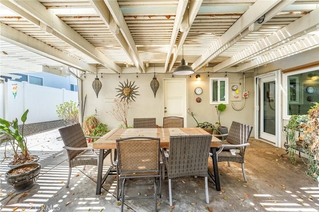 view of patio / terrace with a pergola, fence, and outdoor dining space