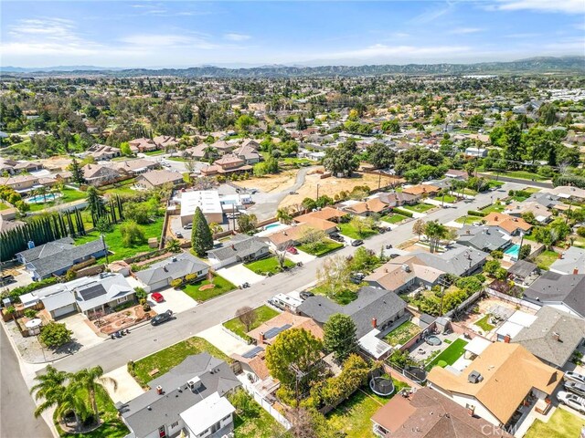 drone / aerial view featuring a mountain view and a residential view