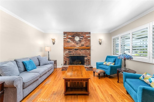 living room with crown molding, a brick fireplace, and wood finished floors
