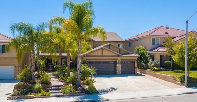 24963 Sunset Vista Ave, Menifee, CA 92584 - view of front of property featuring concrete driveway, a garage, and stucco siding